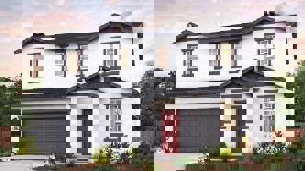 A white house with a garage.