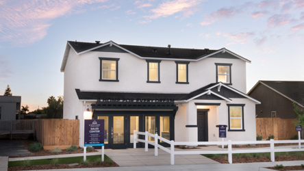 A house with a white picket fence.