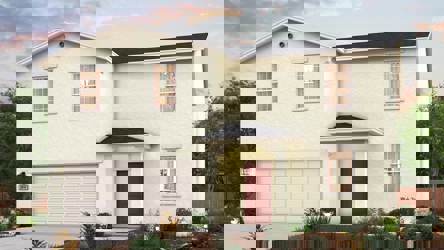 A white house with a garage.