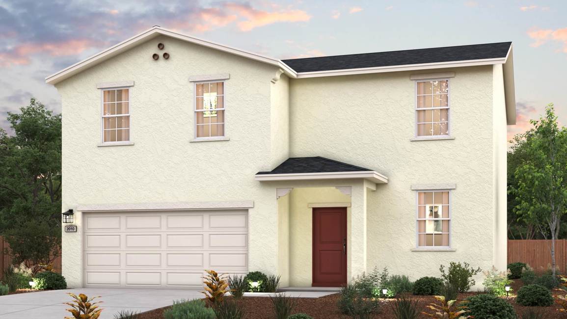 A white house with a garage.