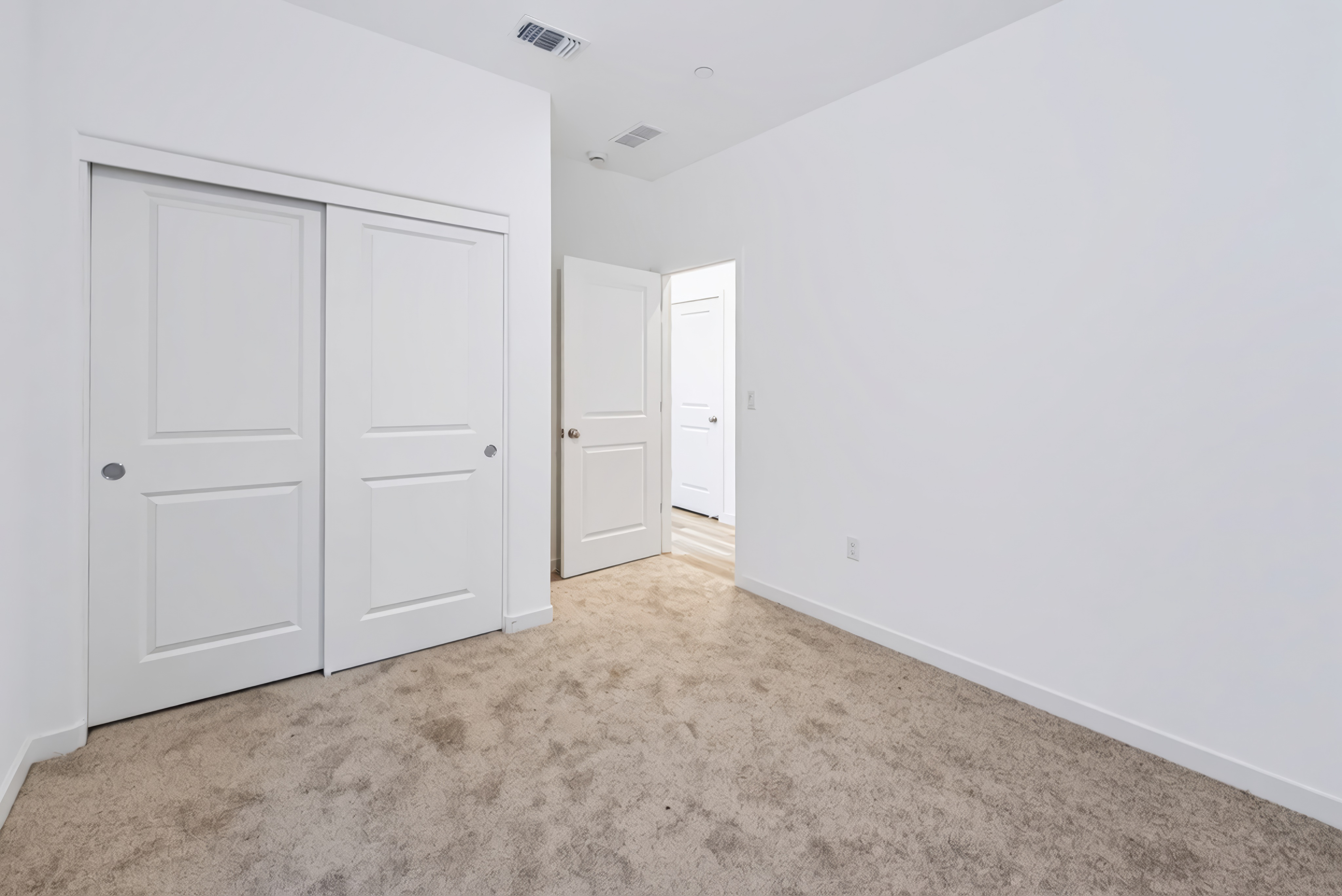 A room with white doors.