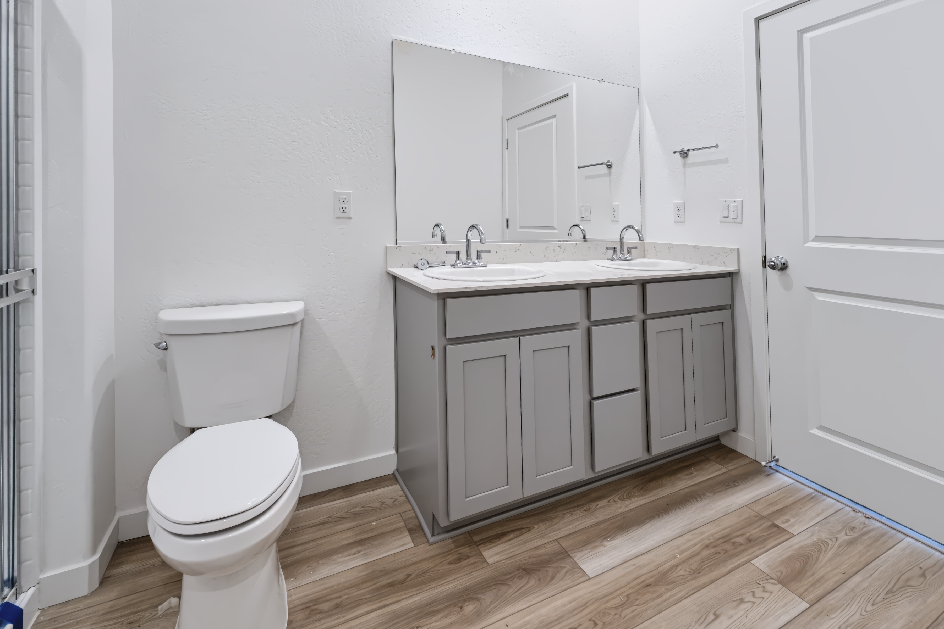 A bathroom with a toilet and sink.