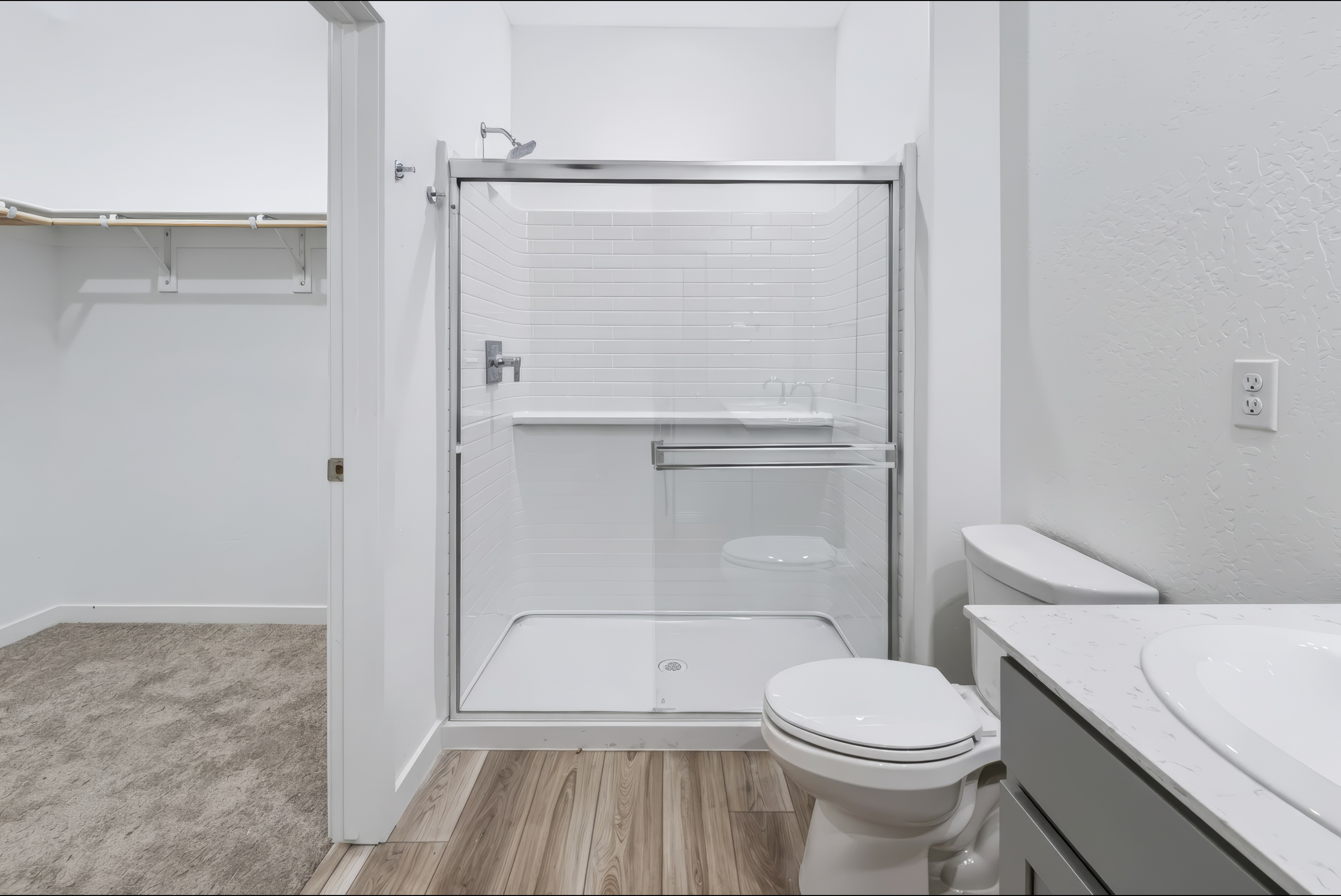 A bathroom with a glass shower.