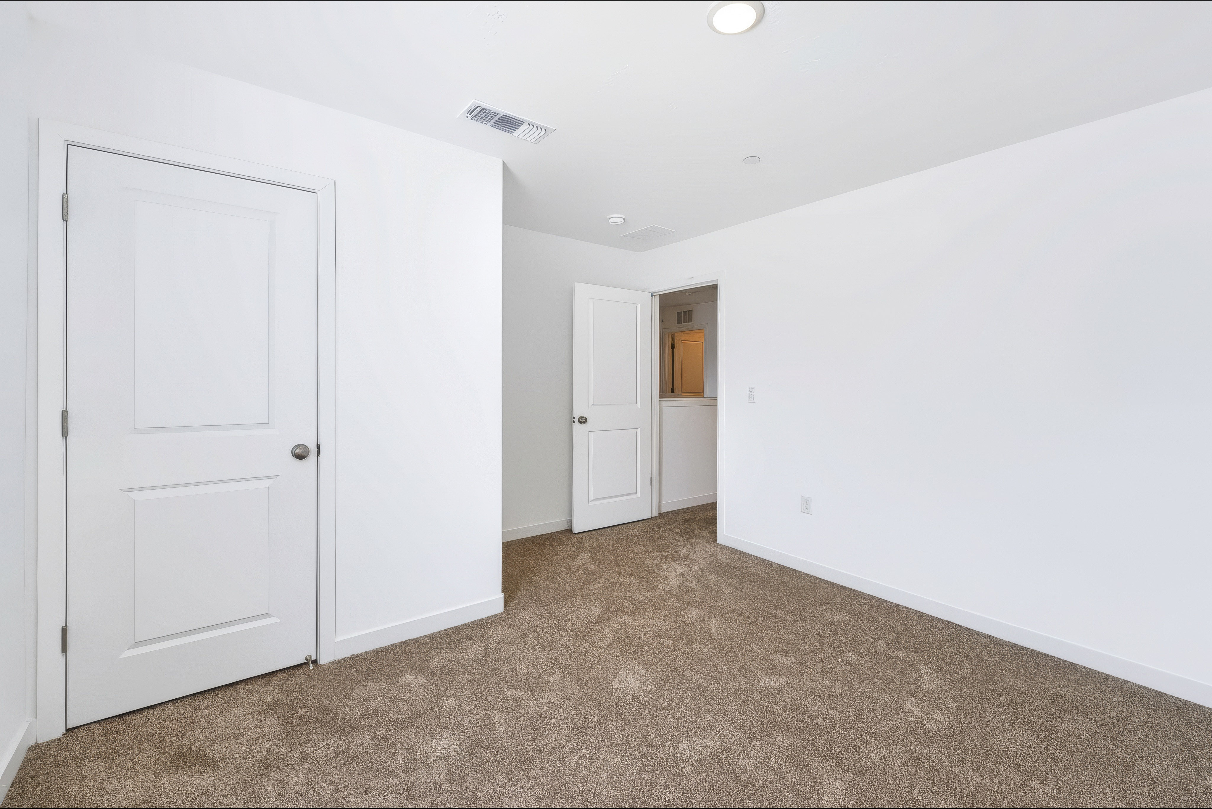 A room with white doors.