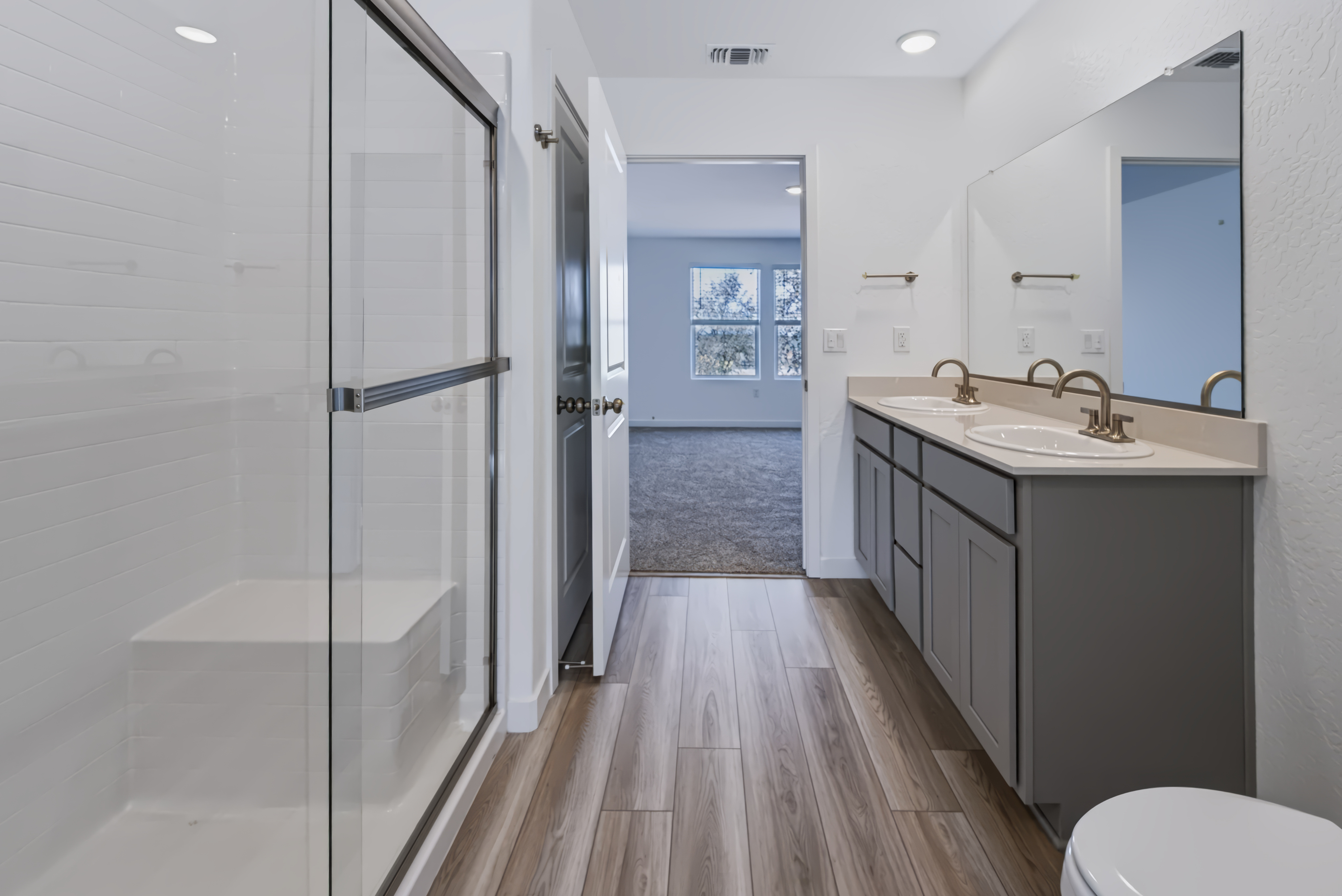A bathroom with a glass shower.
