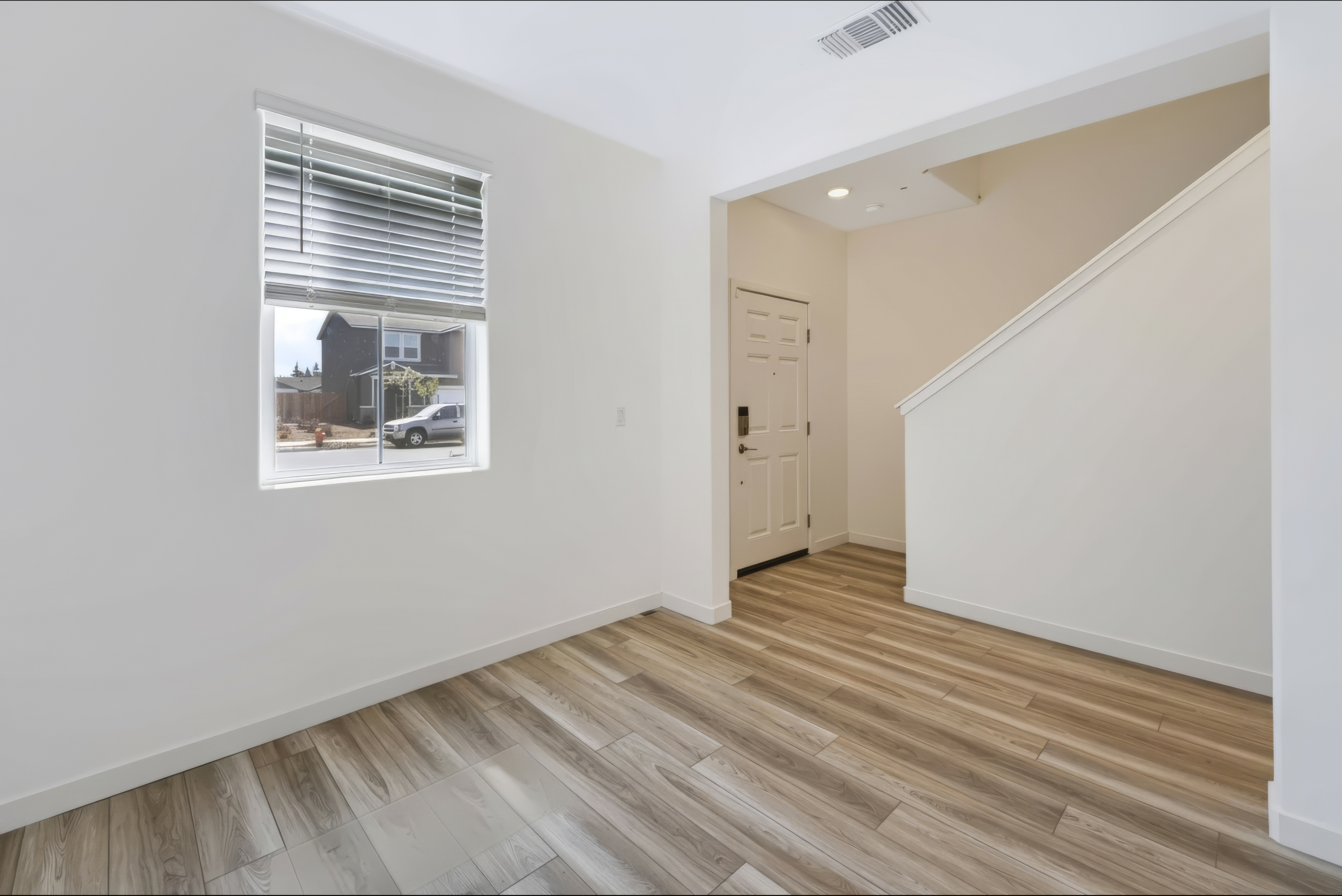 A room with a wood floor and a wood floor.