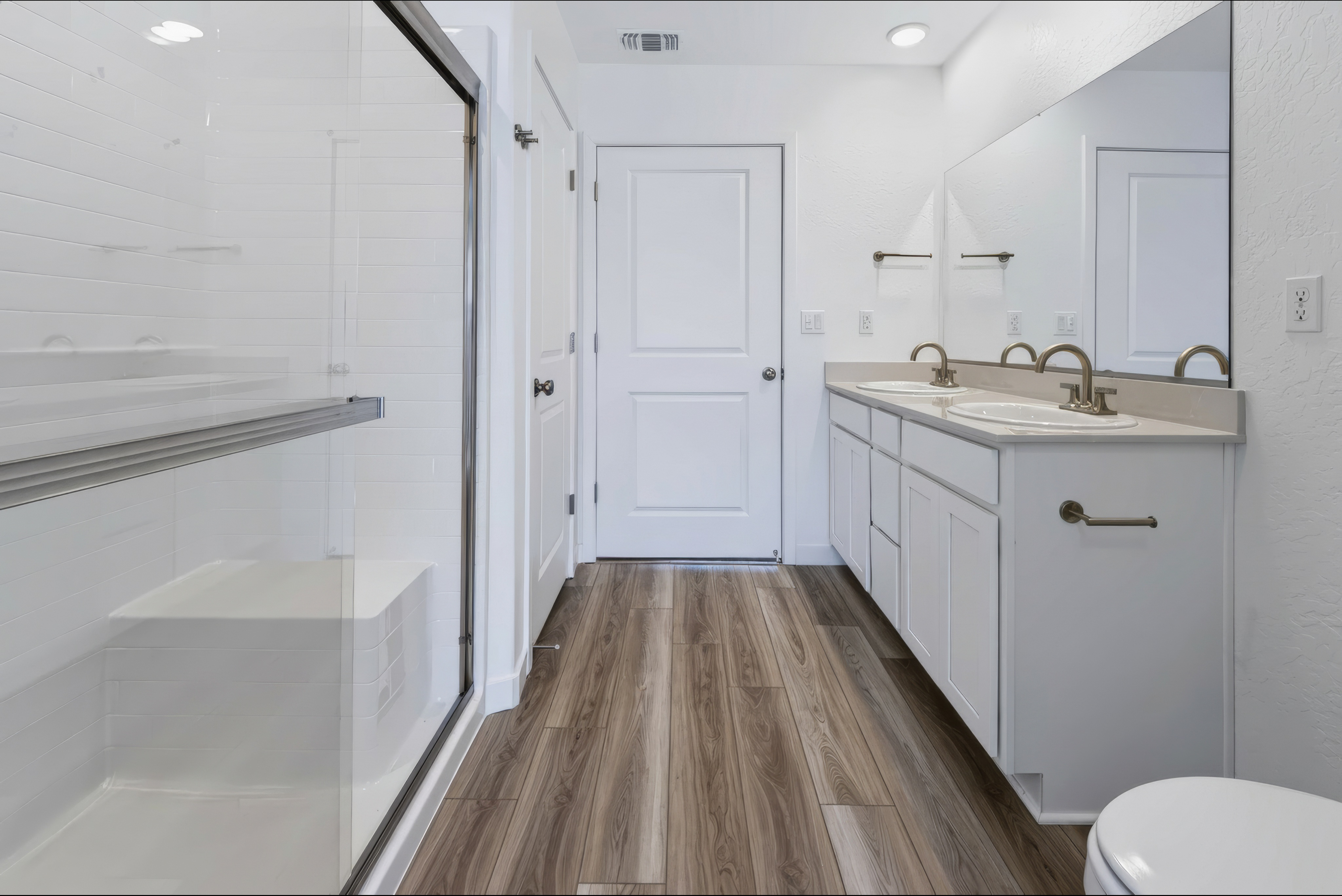 A bathroom with white walls.