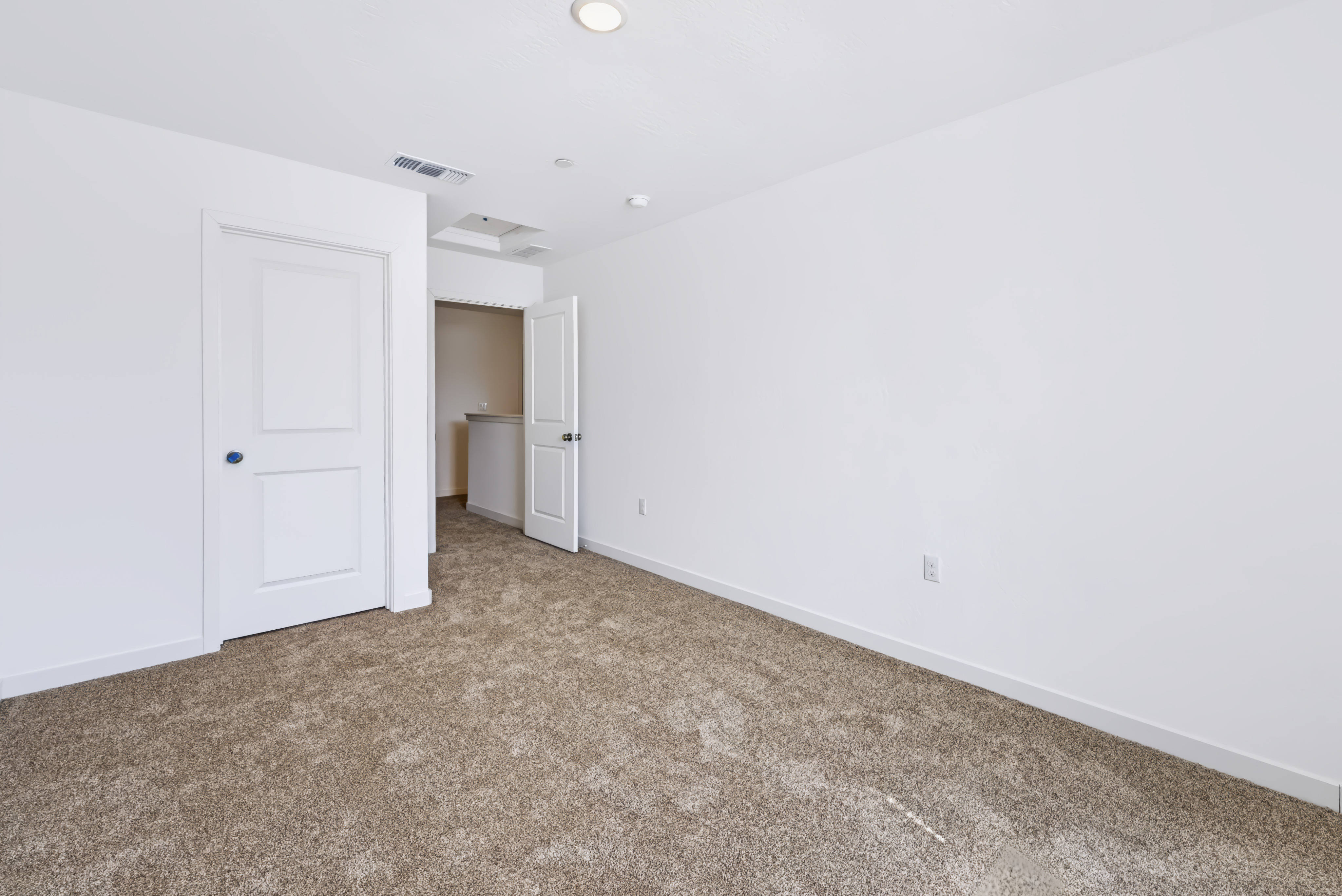 A room with white doors.