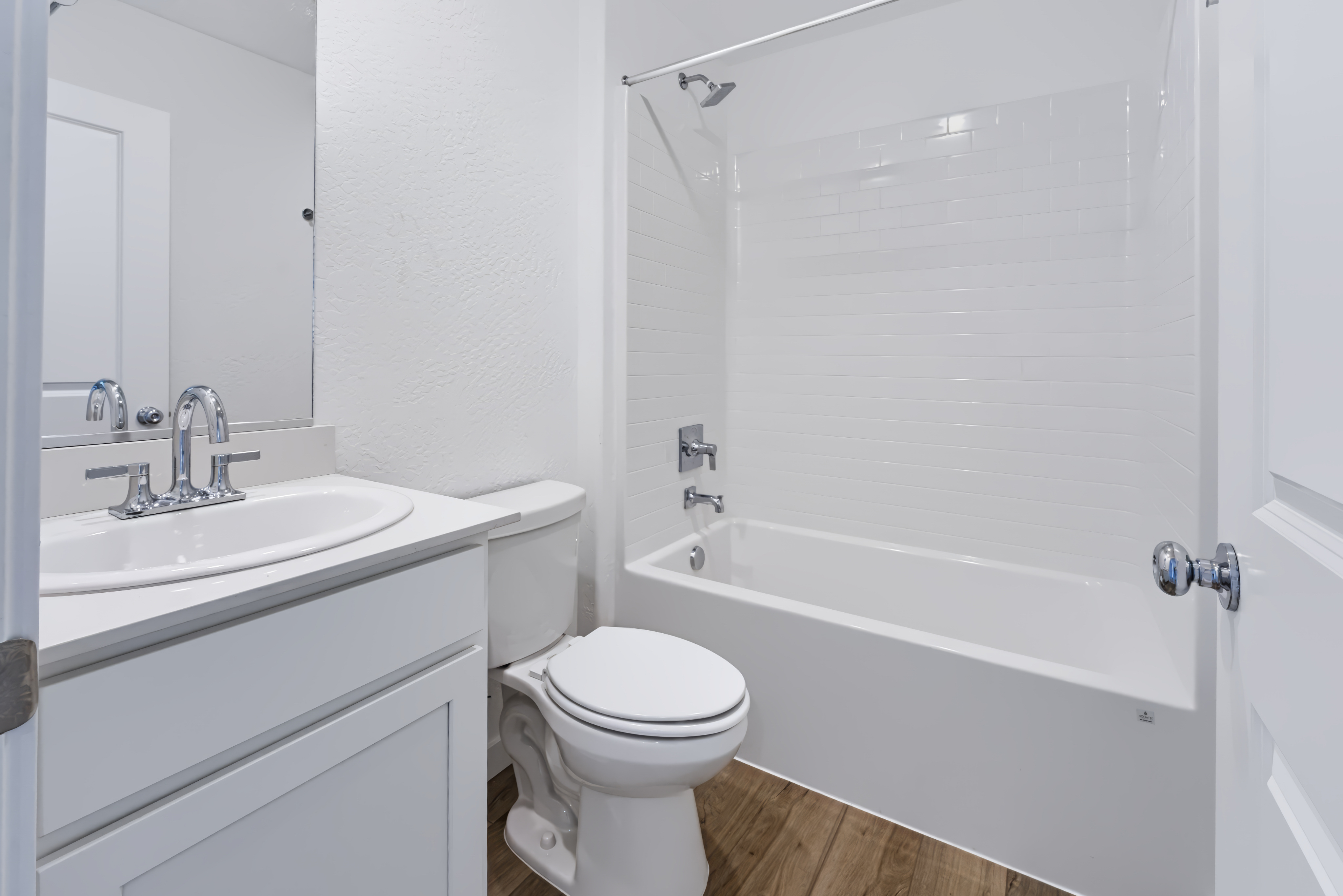 A bathroom with a toilet and sink.