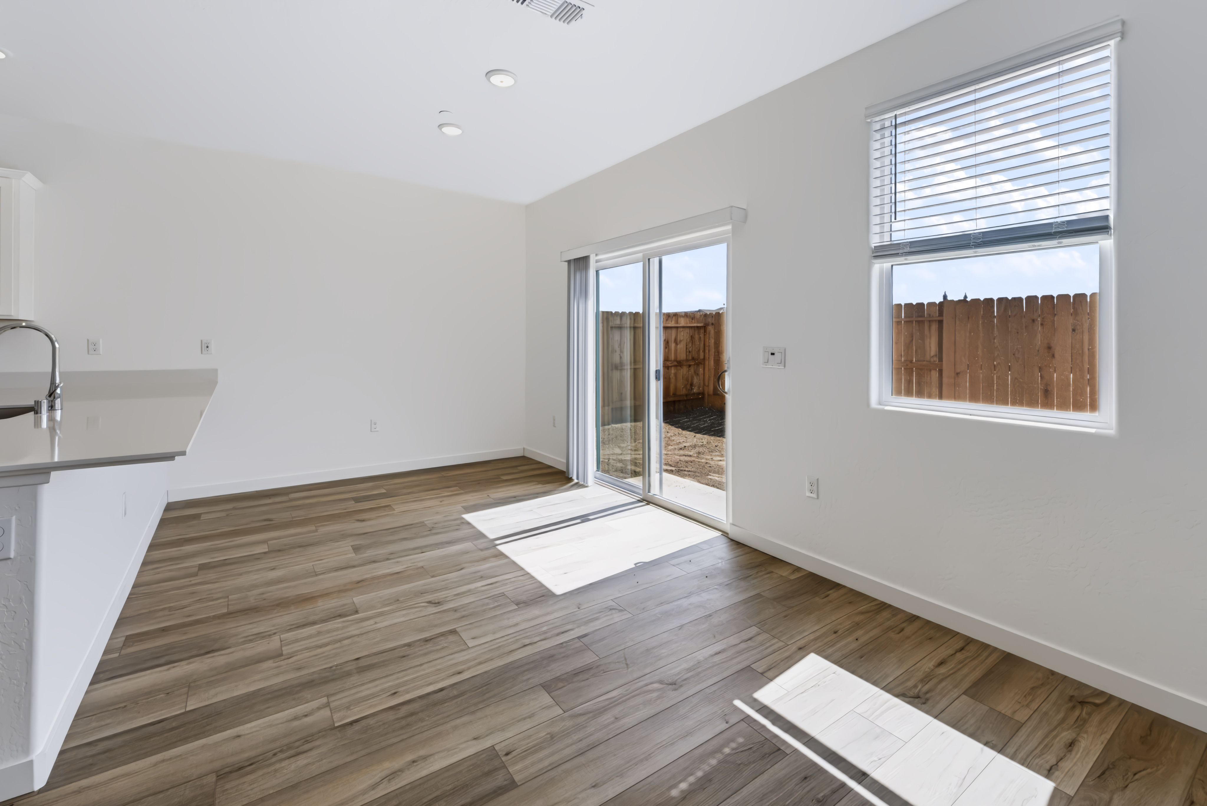A kitchen with a wood floor.