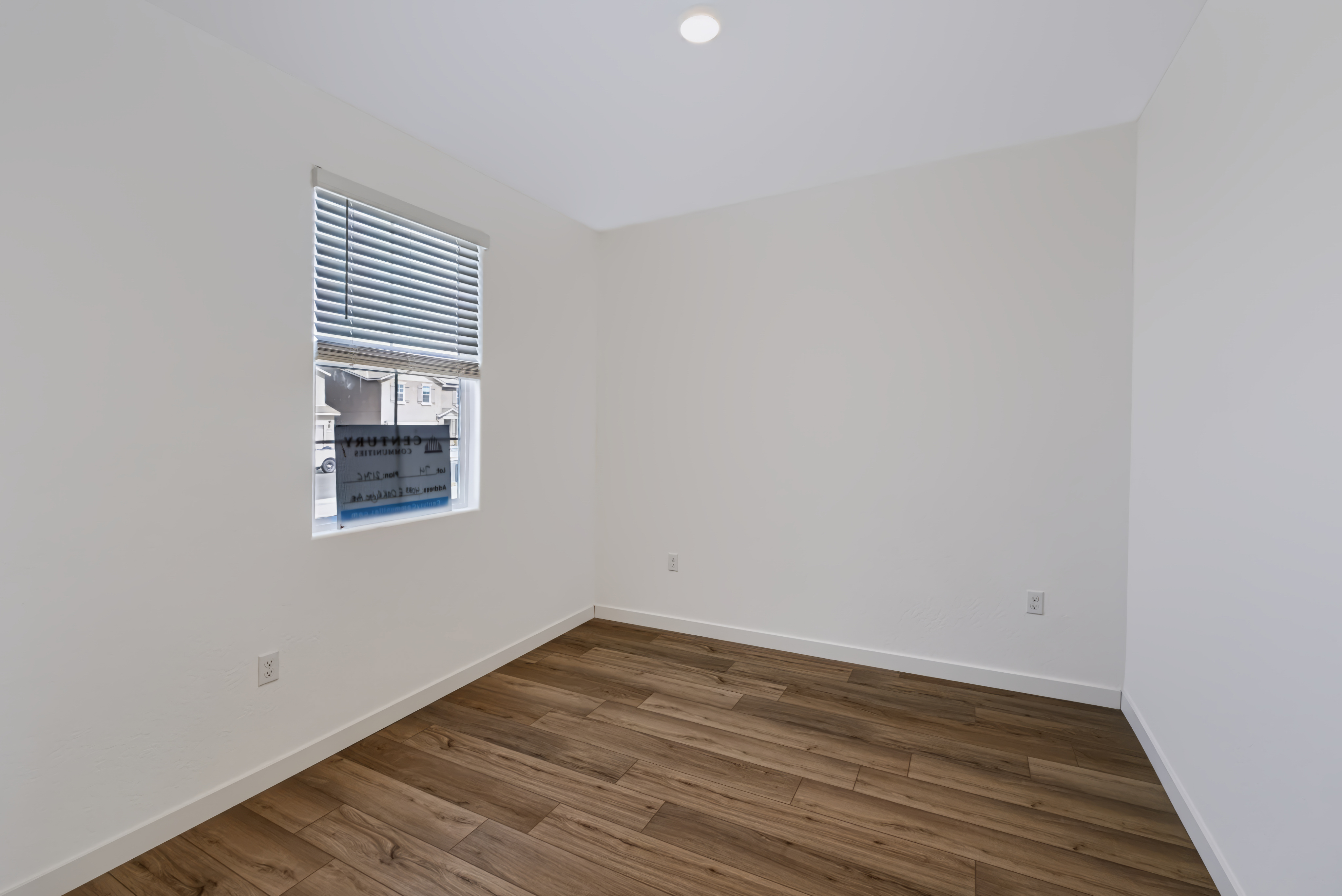 A room with a wood floor and a wood floor.