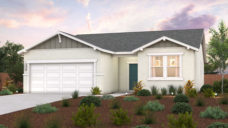 A house with a garage and bushes in front of it.