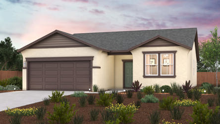 A house with a garage and a garden in front of it.