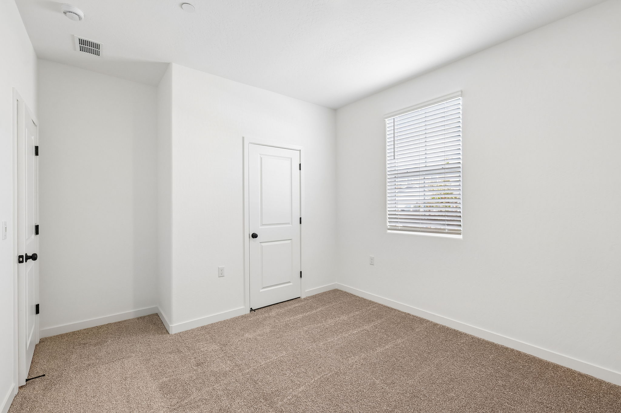 A room with white doors.