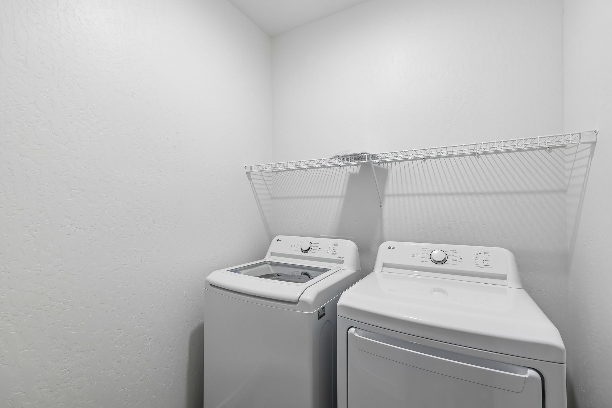 A washing machine in a room.
