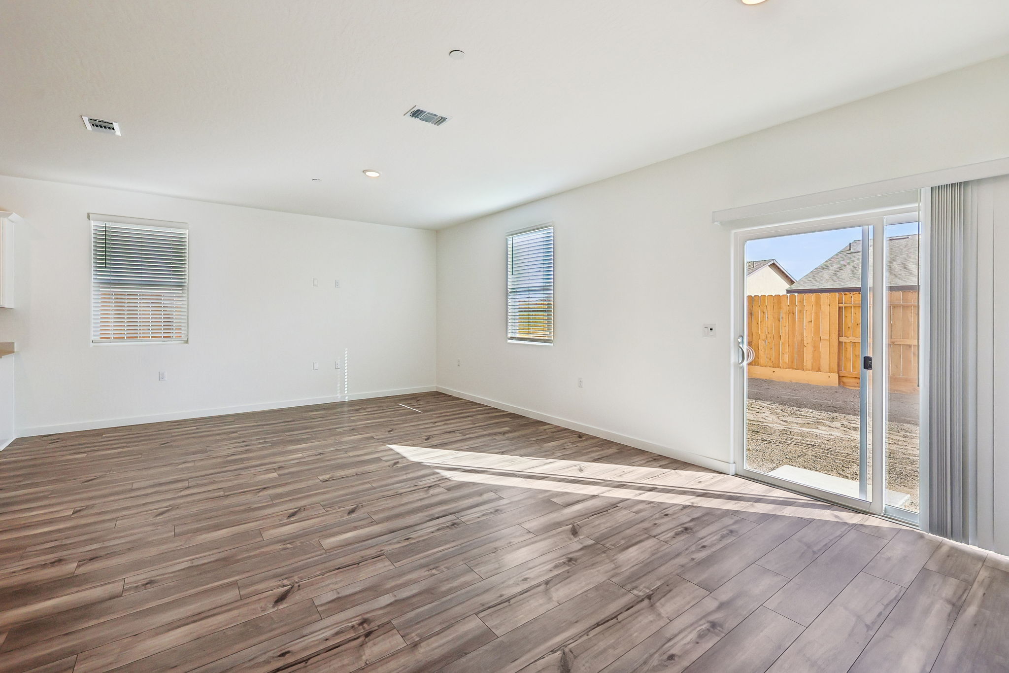 A room with a wood floor and a wood floor.