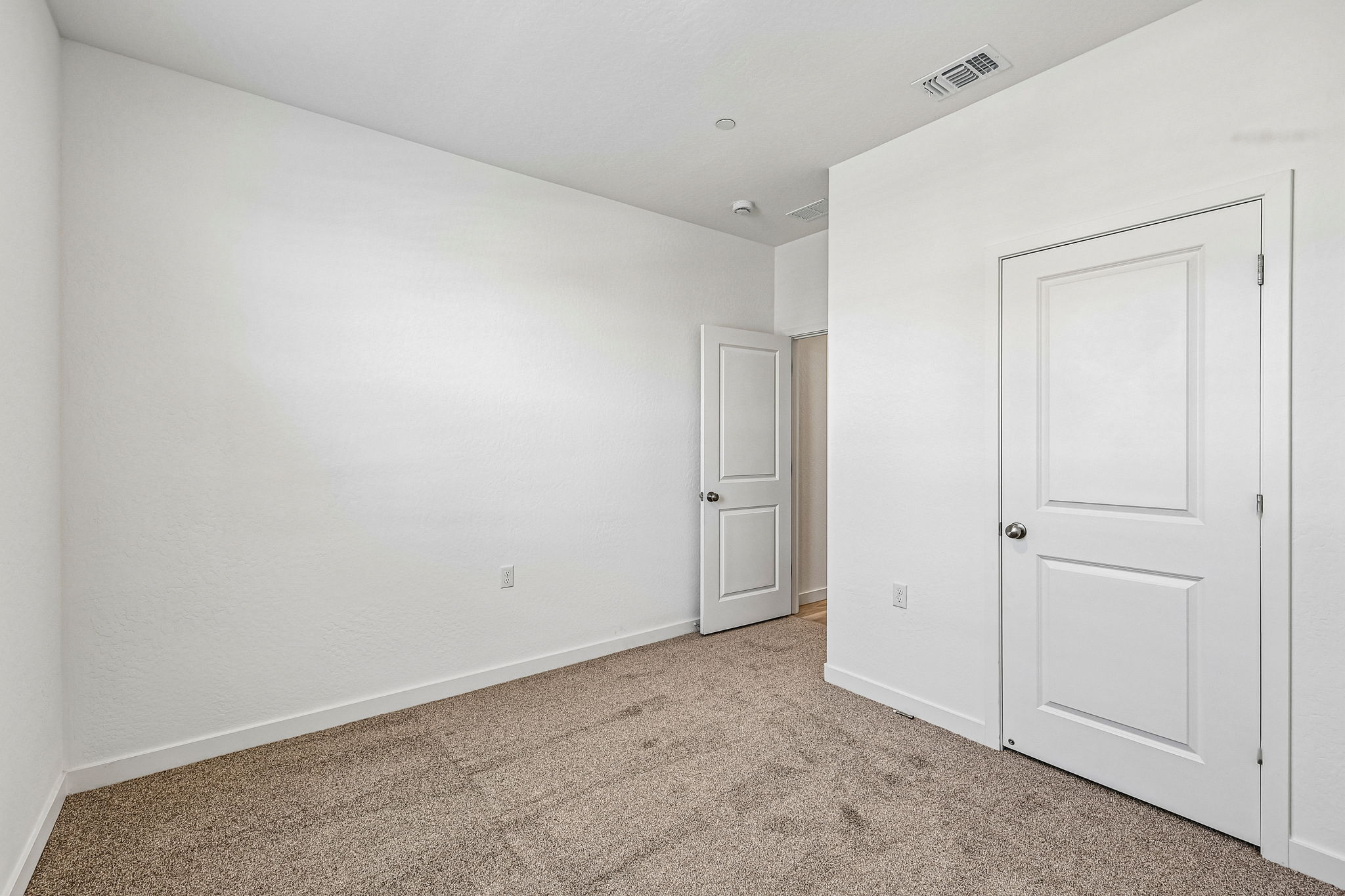 A room with white doors.