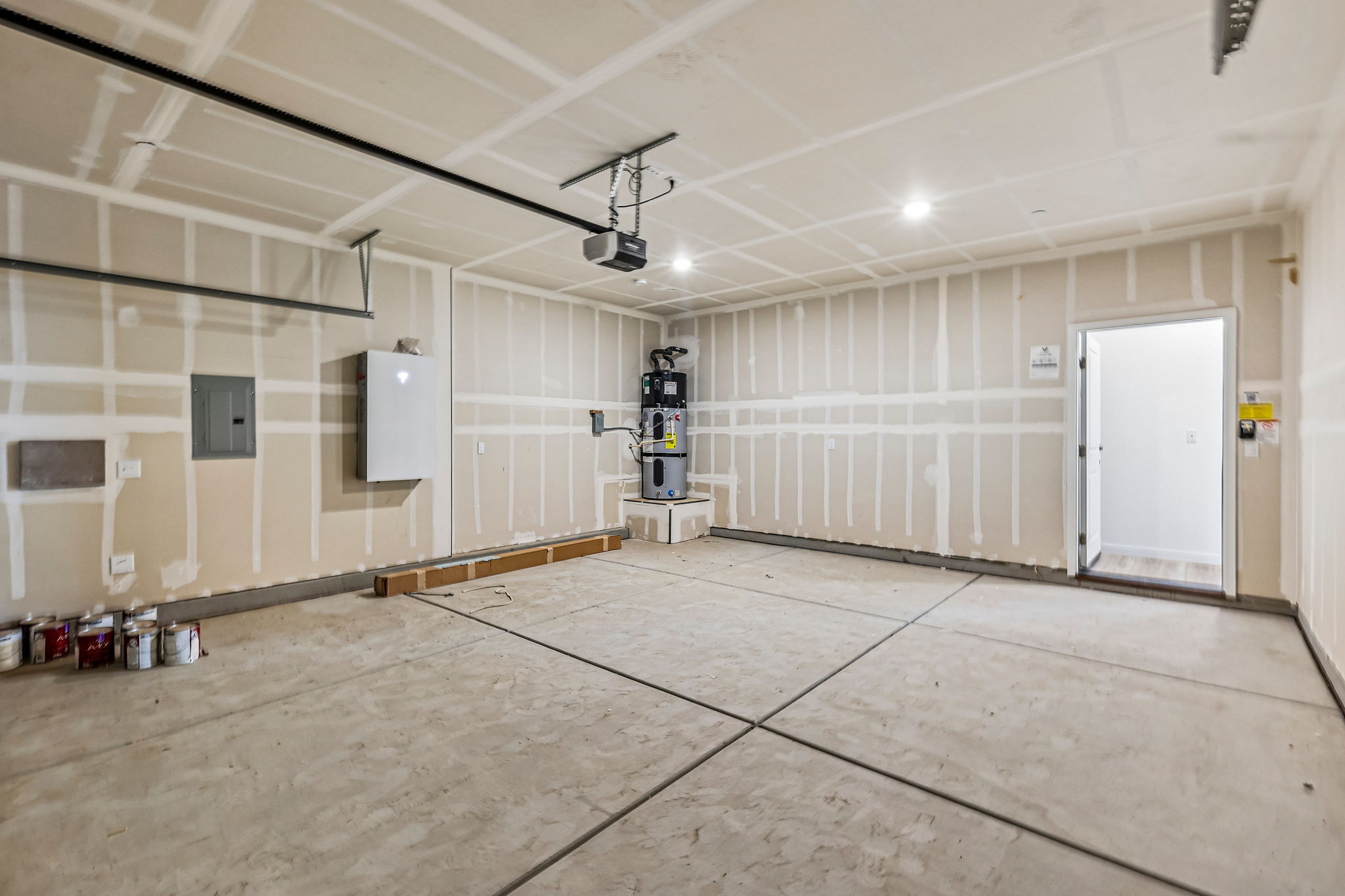 A room with a tile floor and a white door.
