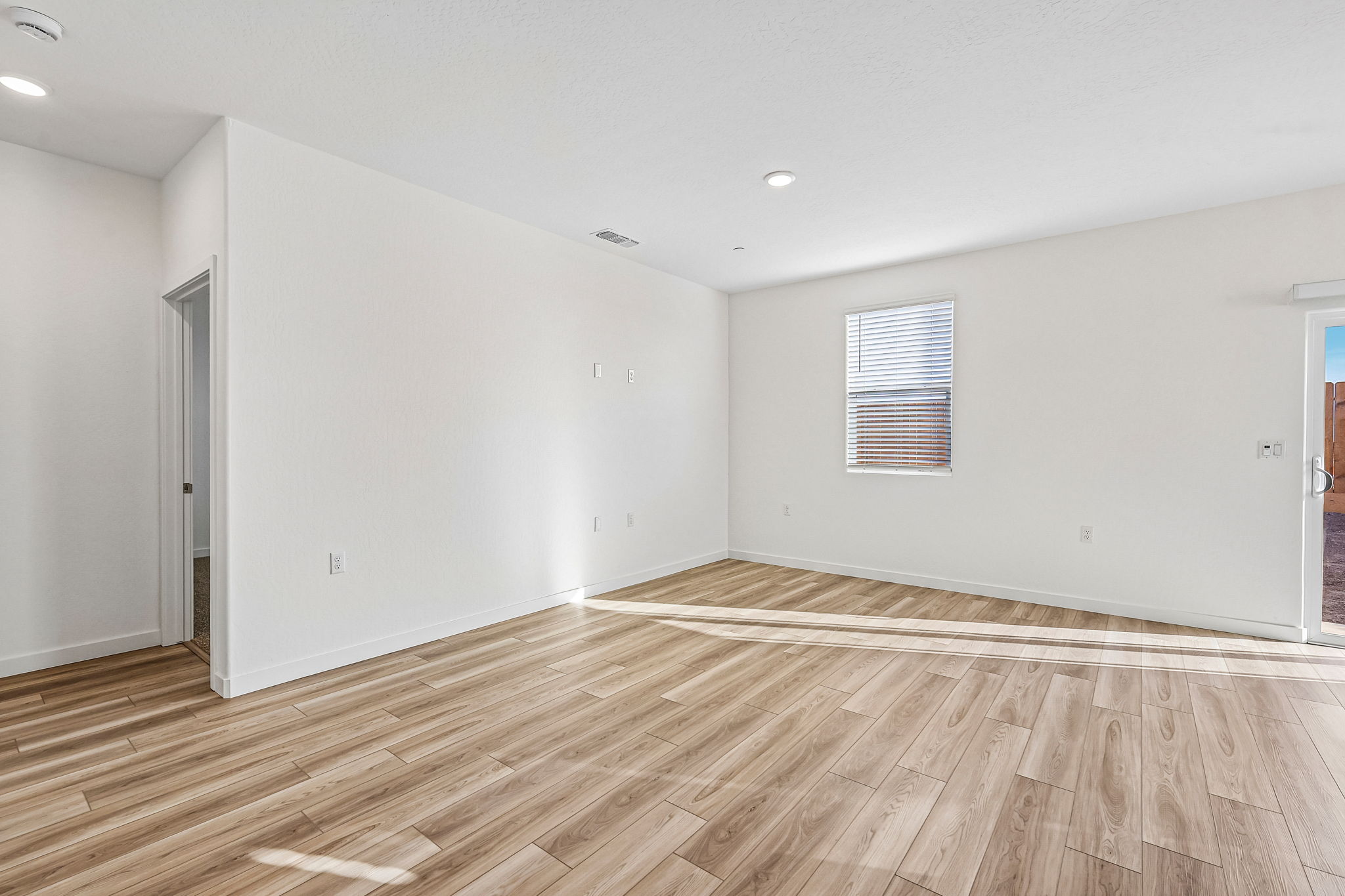 A room with a wood floor and a wood floor.