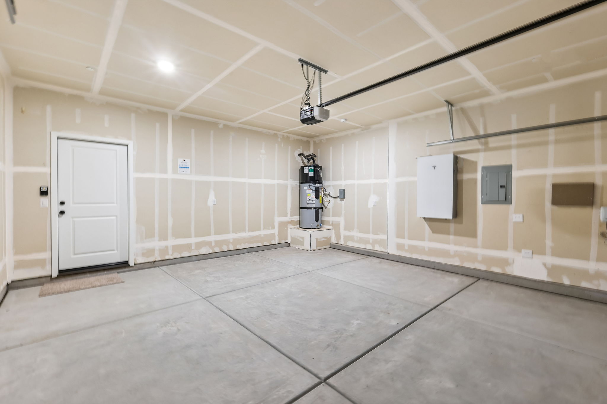A room with a tile floor and a white door.