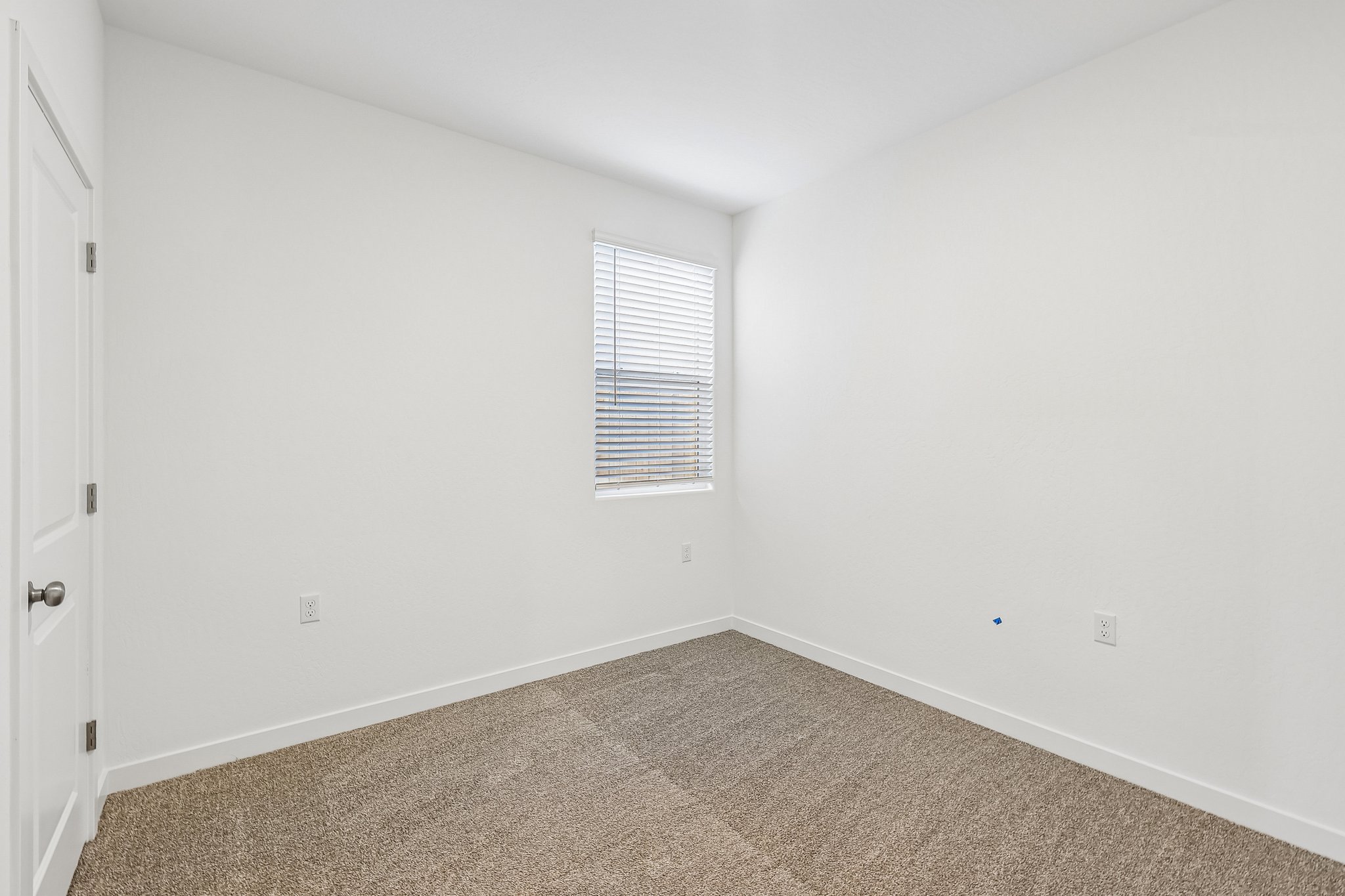 A room with a door and a window.