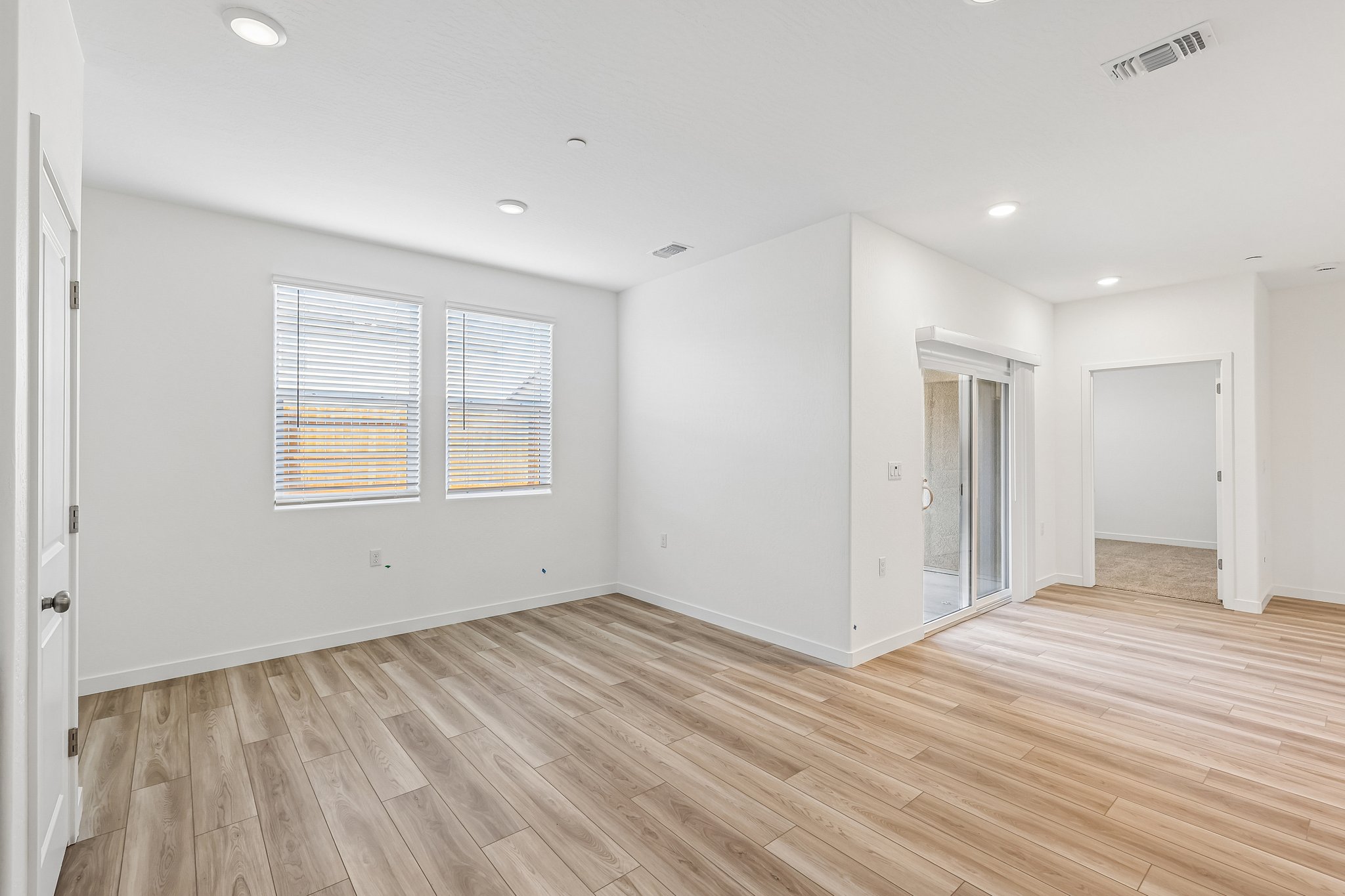 A room with wood floors.