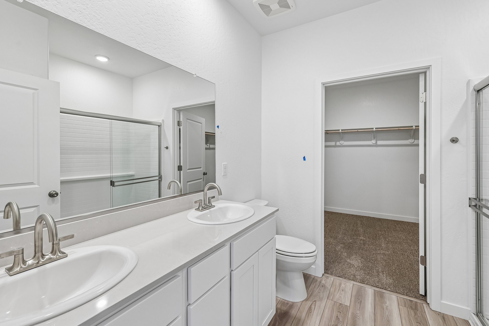 A bathroom with a glass shower.