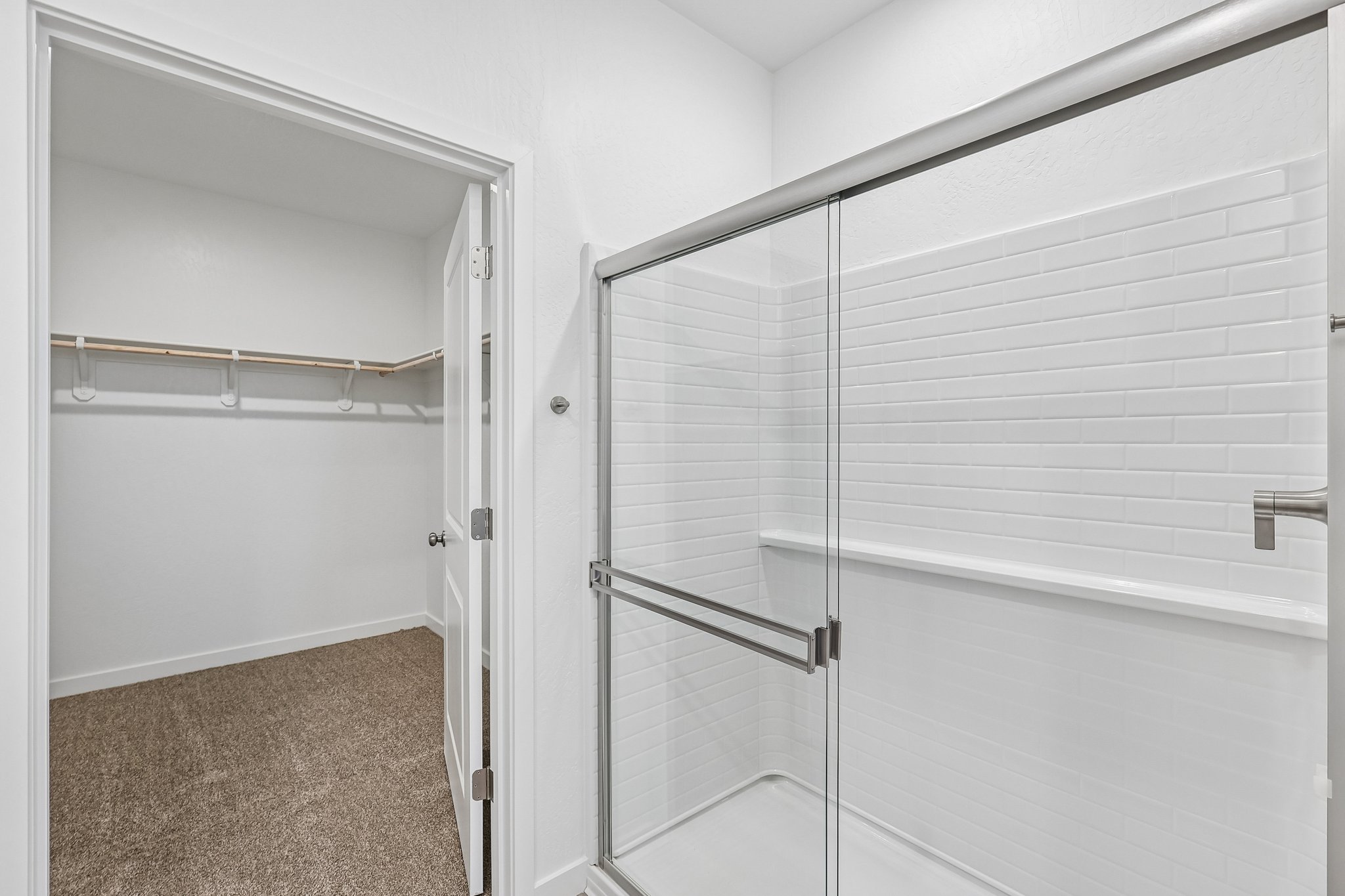 A shower with a glass door.