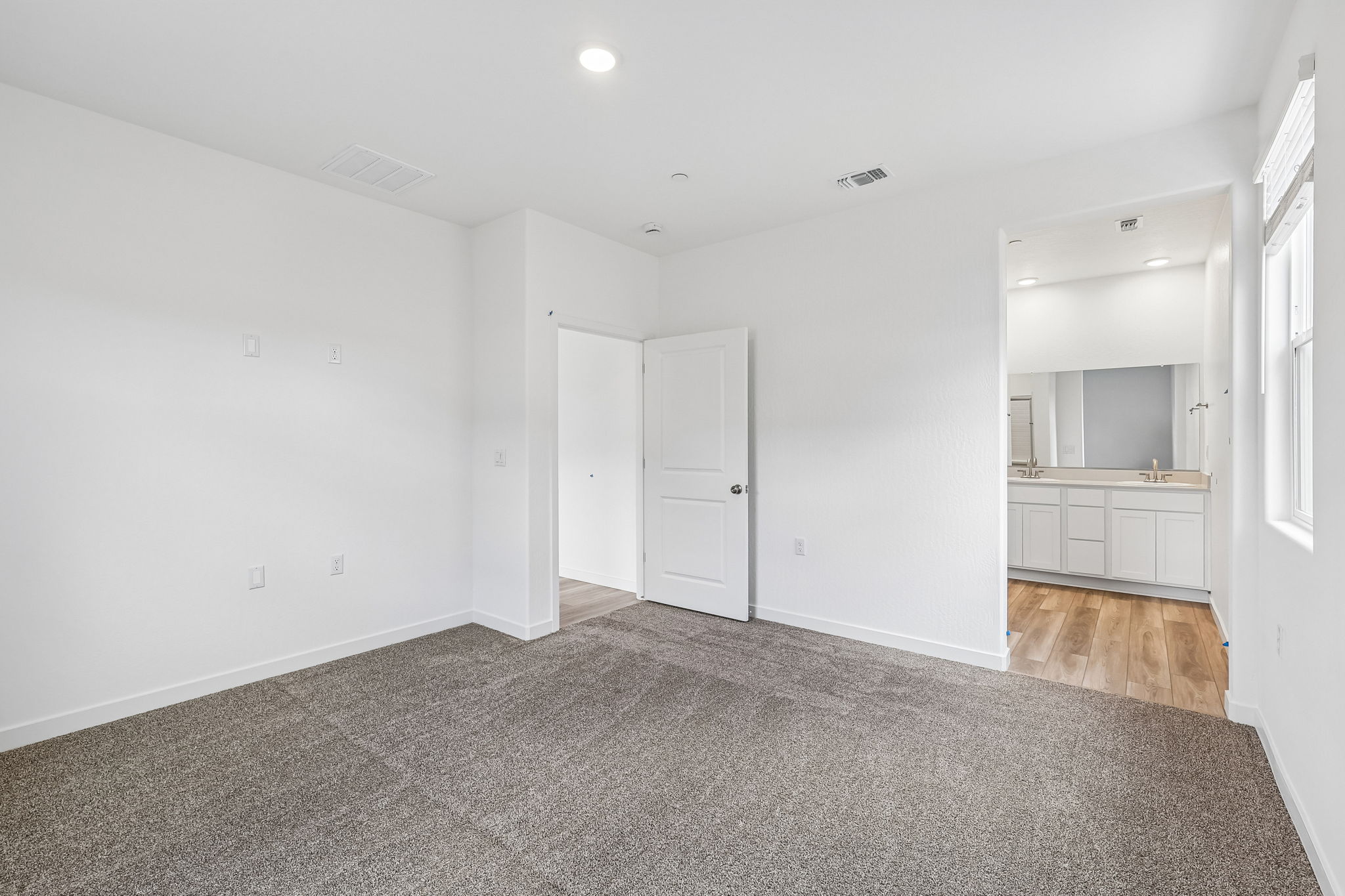 A room with white cabinets.