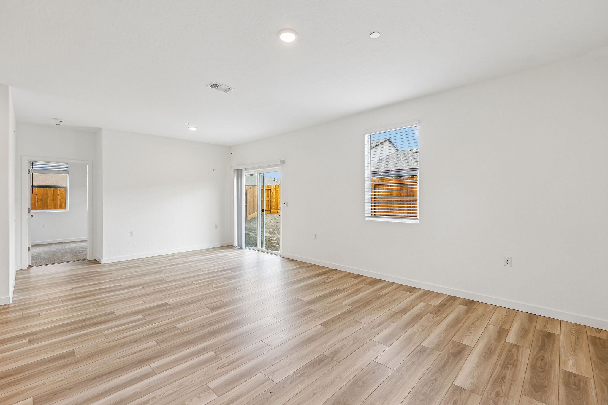 A room with a wood floor and a wood floor.