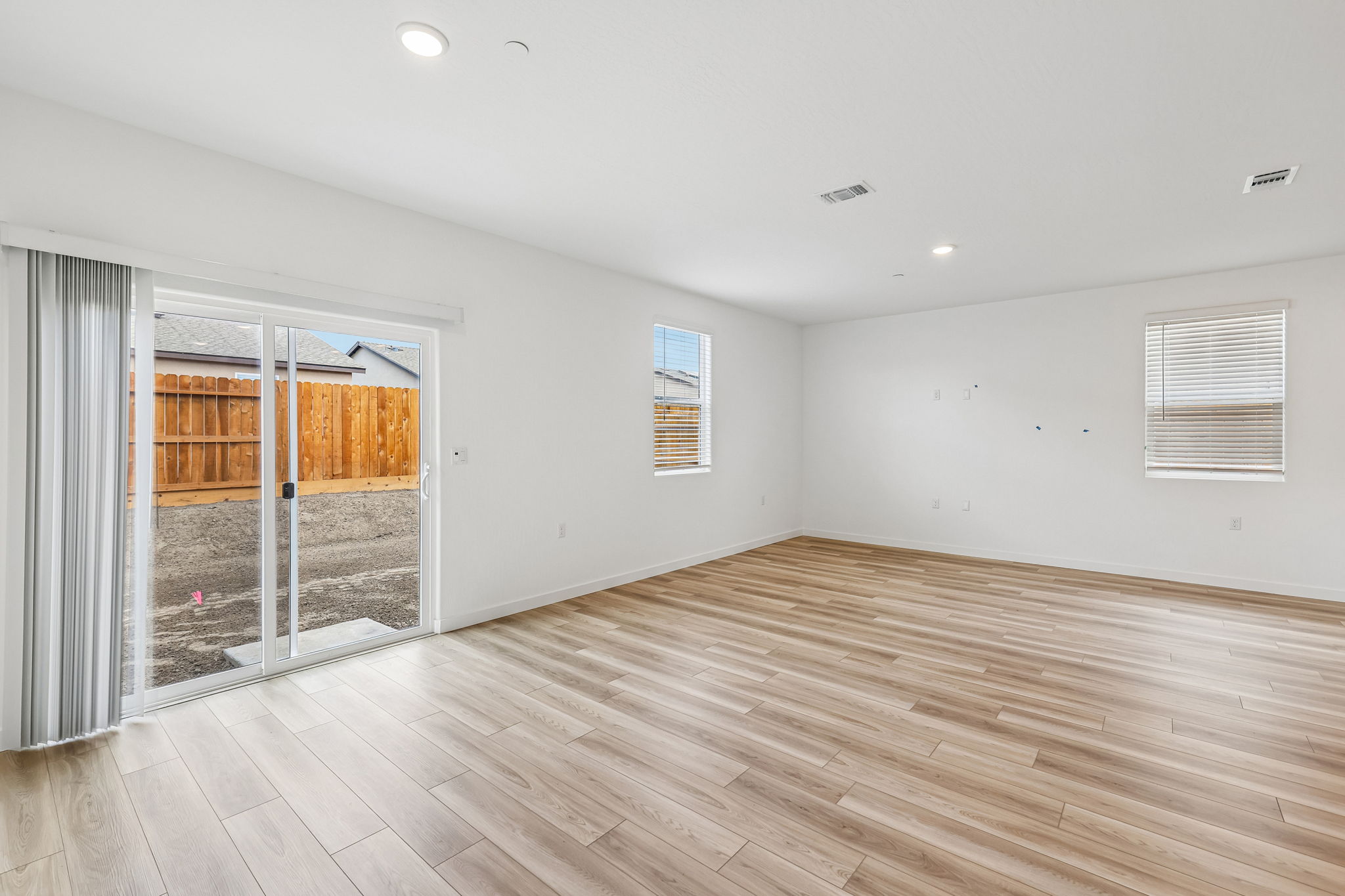 A room with a wood floor and a wood floor.