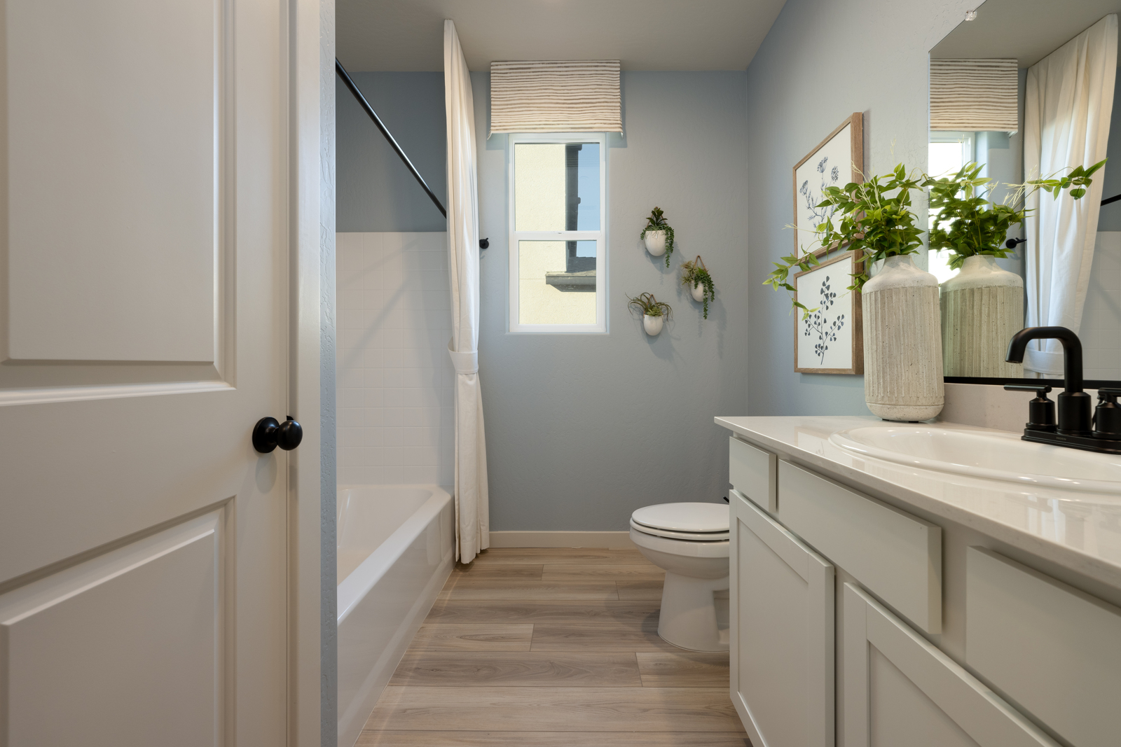 A bathroom with a toilet and sink.