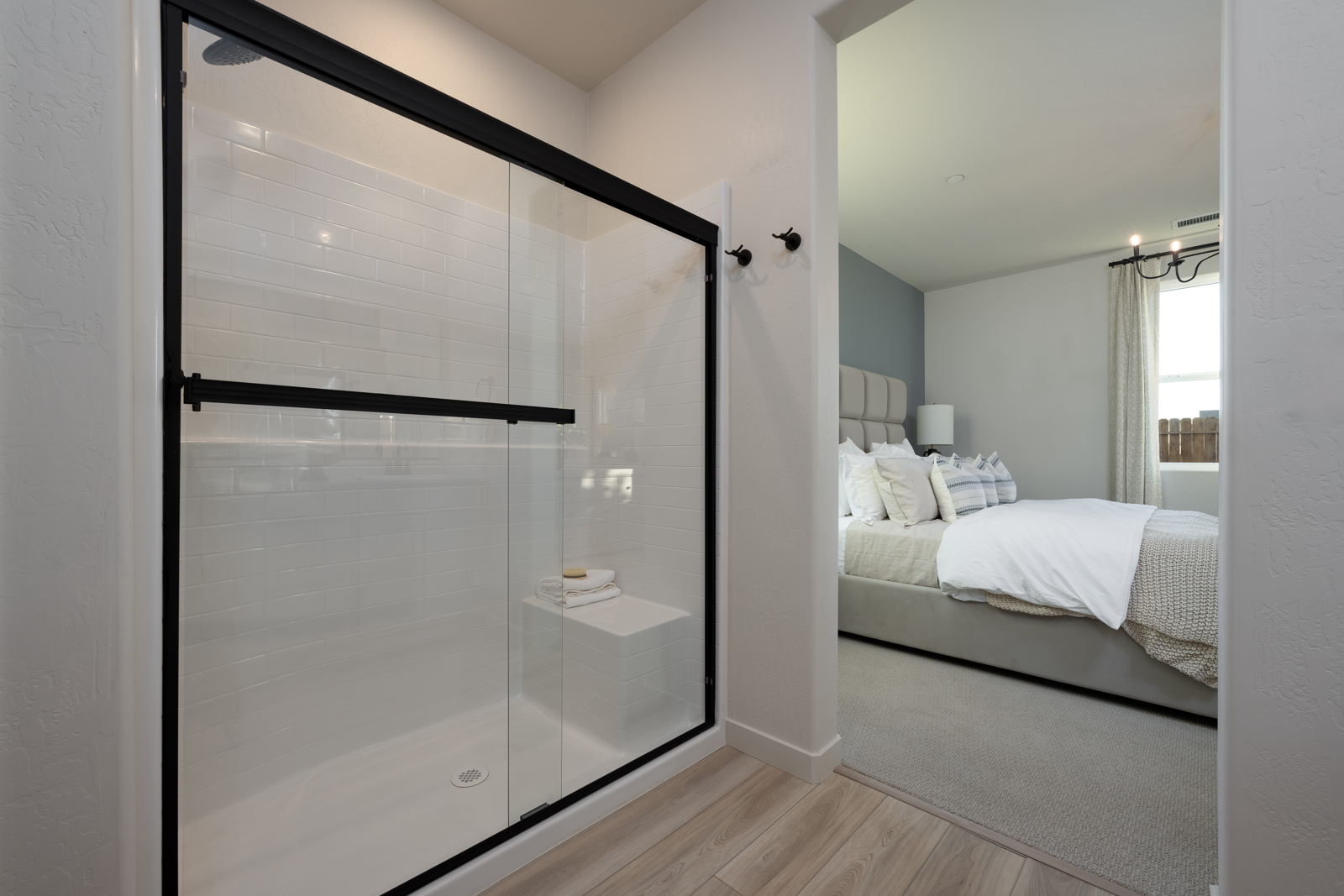 A bedroom with a glass door.