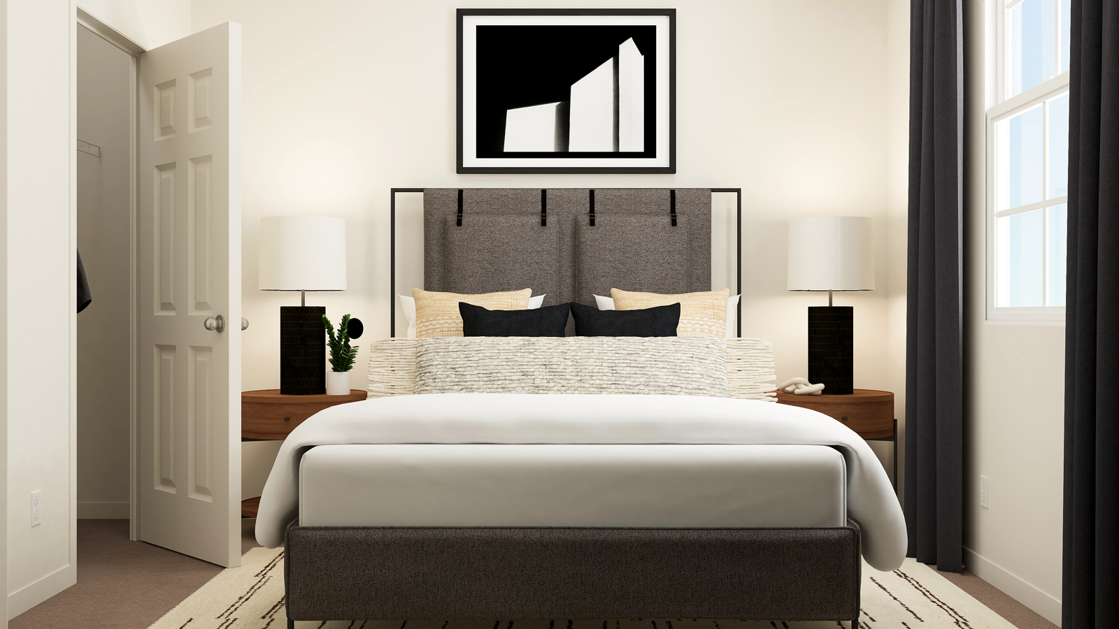 A bed with a white bed spread.