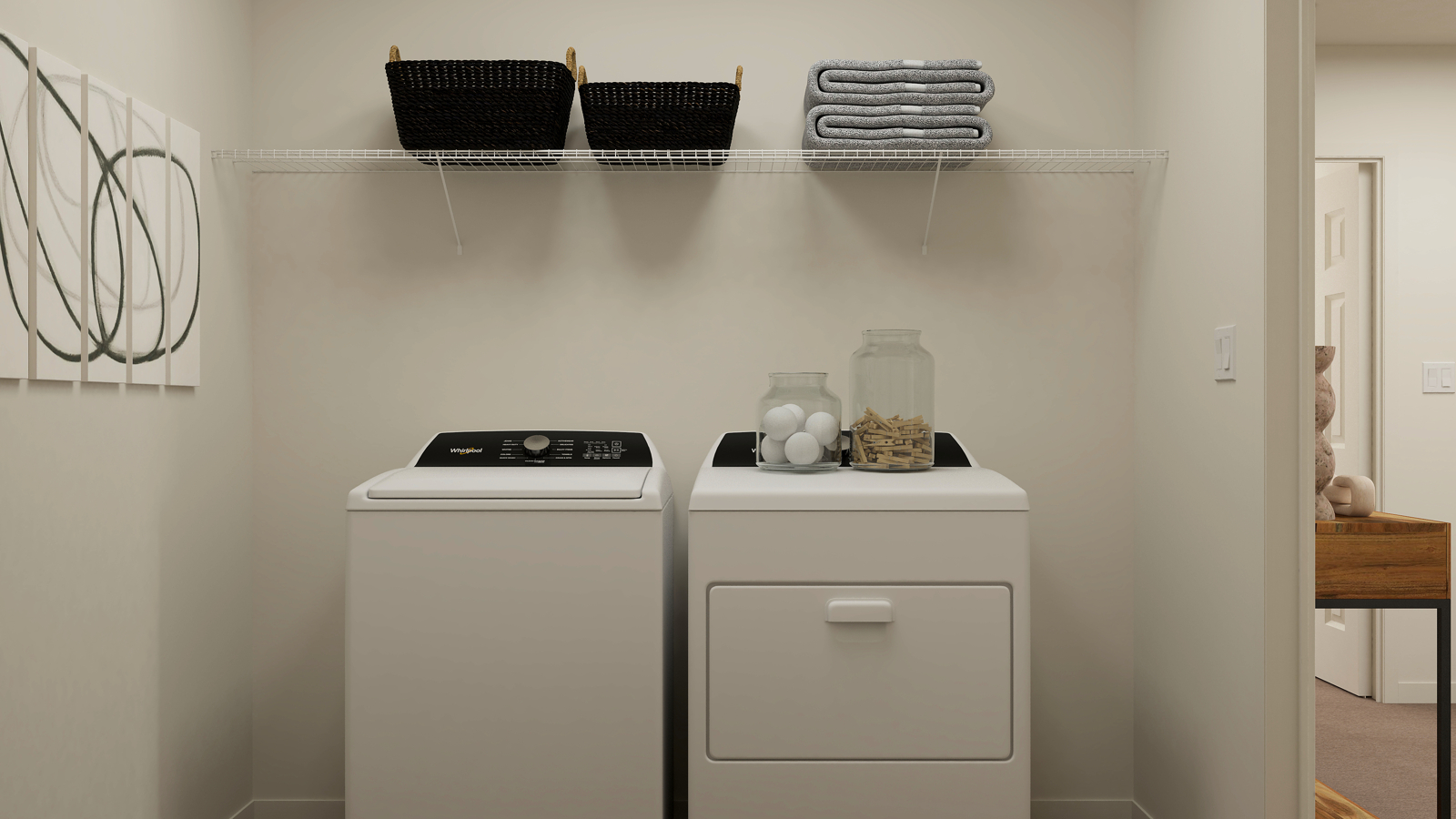 A white laundry room with a white washer and dryer.
