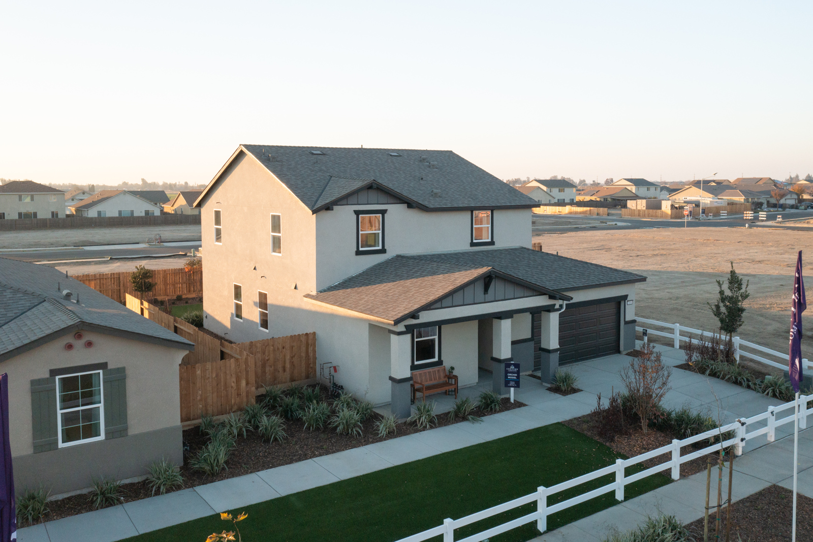 A house with a white fence.