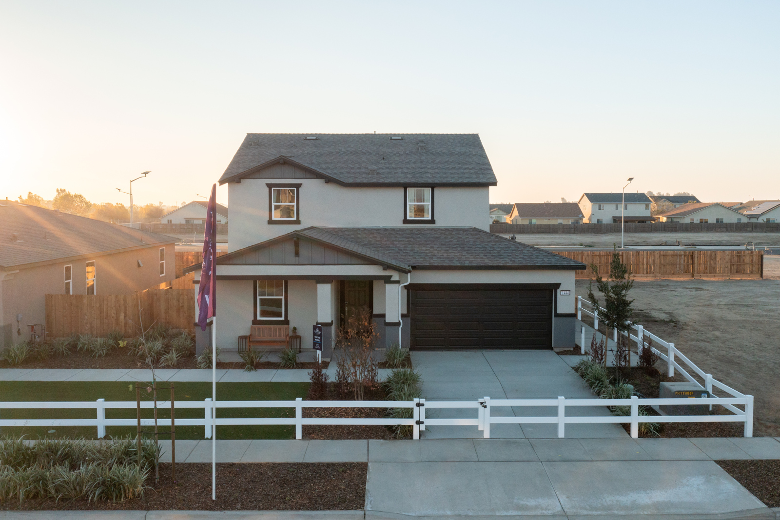 A house with a white fence.