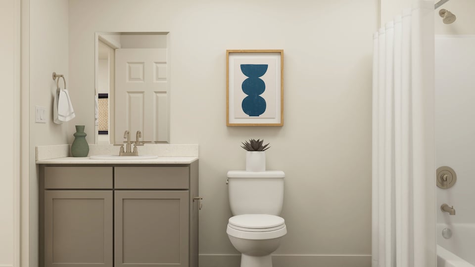 A bathroom with a toilet and a sink.