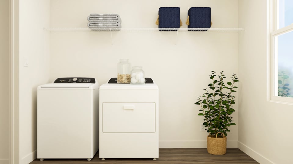 A white cabinet with a plant and a white refrigerator.