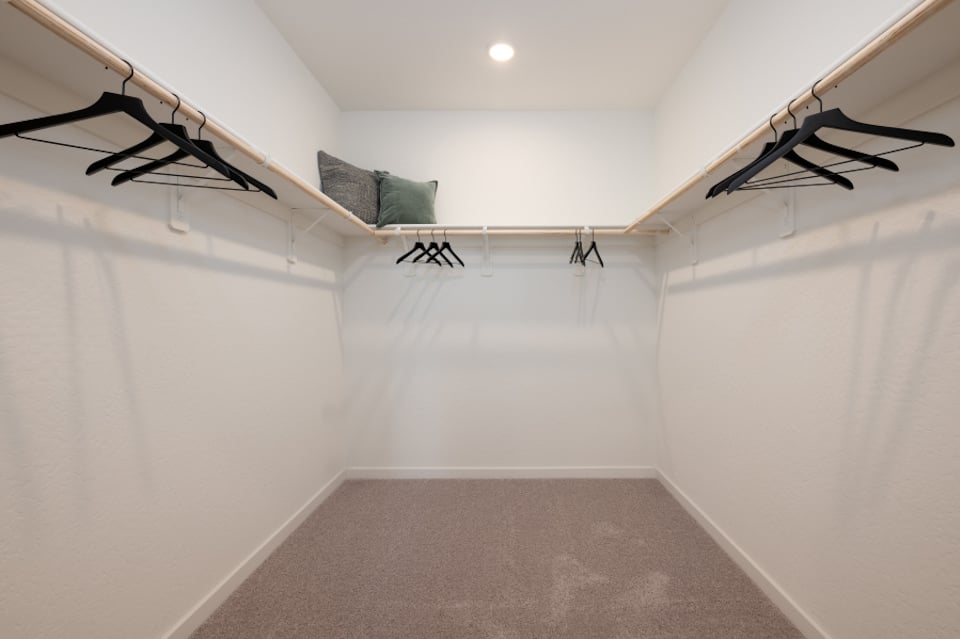 A room with white walls and a staircase.