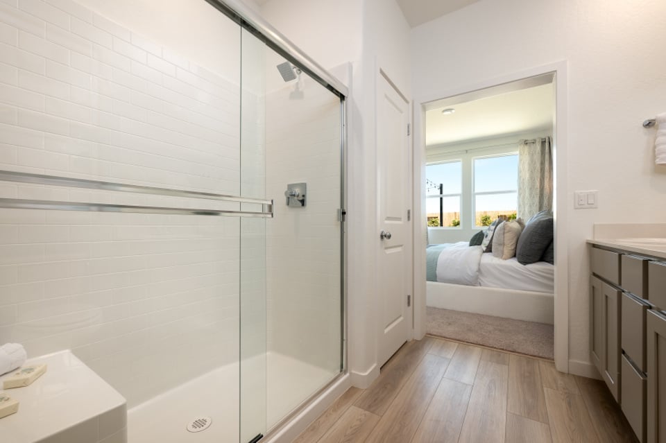 A bedroom with a glass door.