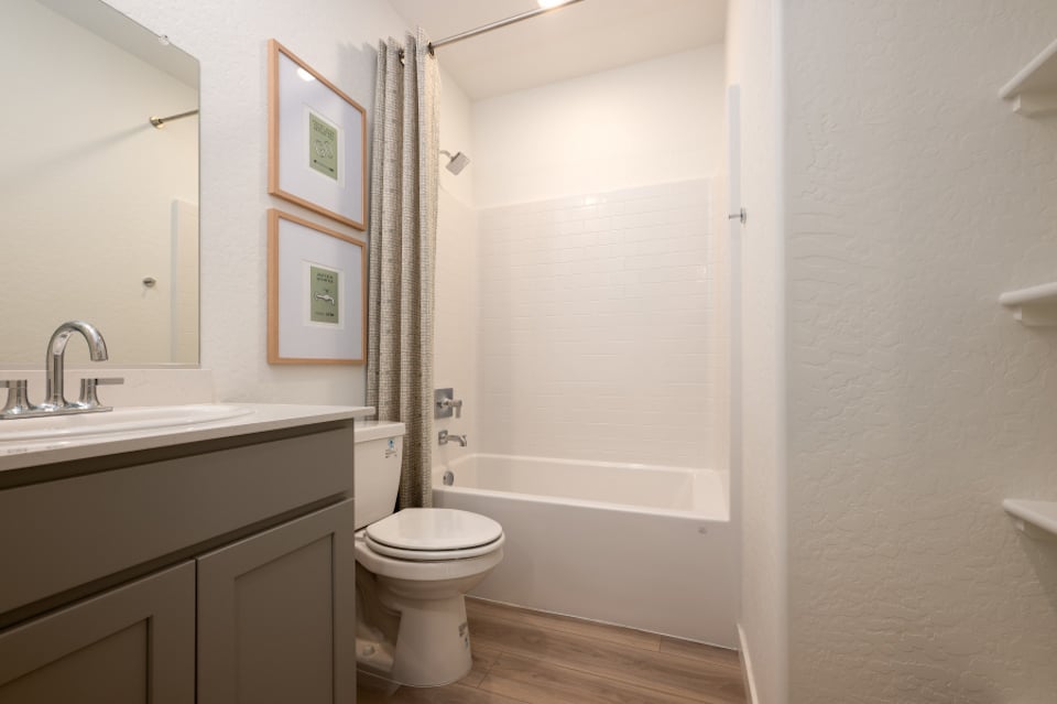 A bathroom with a toilet and sink.