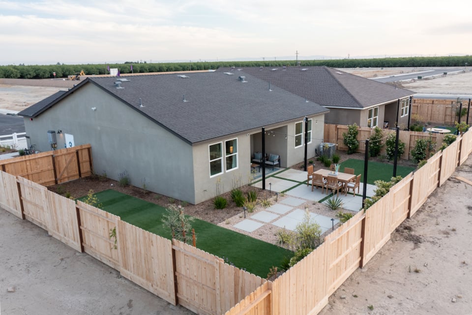 A house with a fence around it.