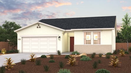 A house with a garage and bushes.