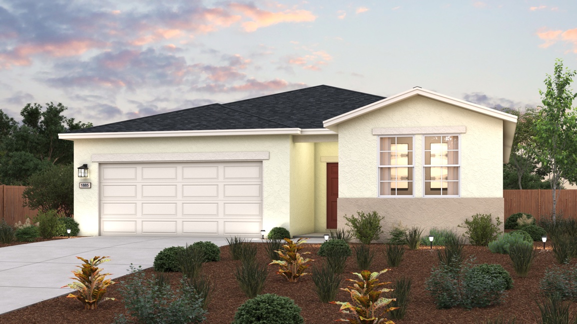 A house with a garage and bushes.