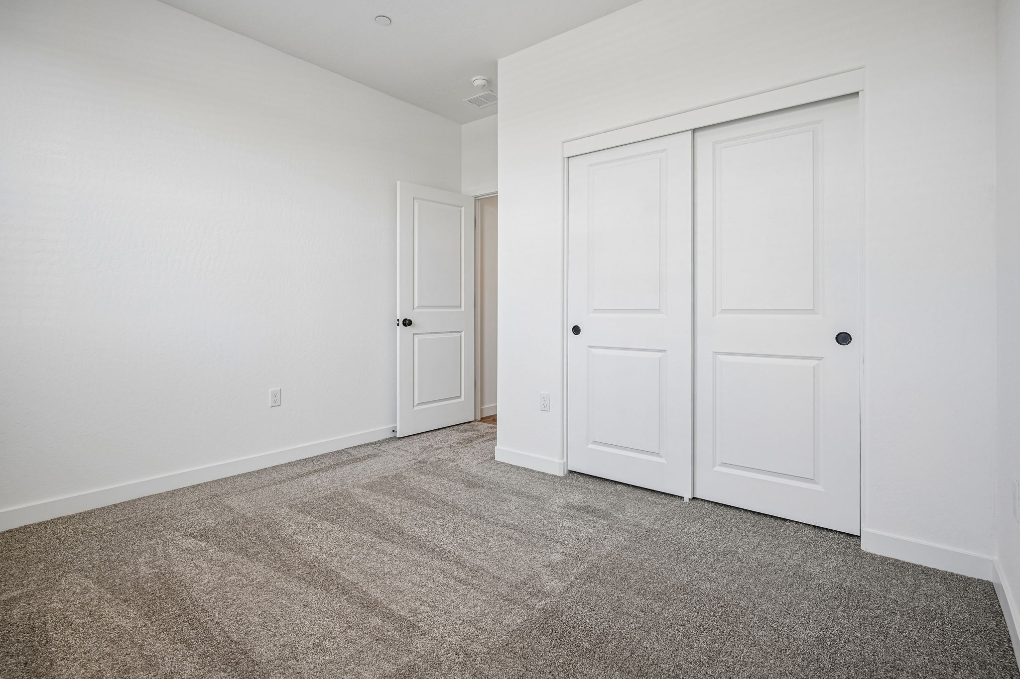 A room with white doors.