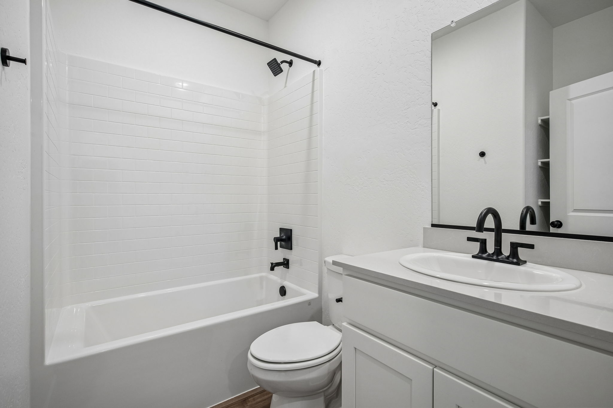 A bathroom with a sink and toilet.