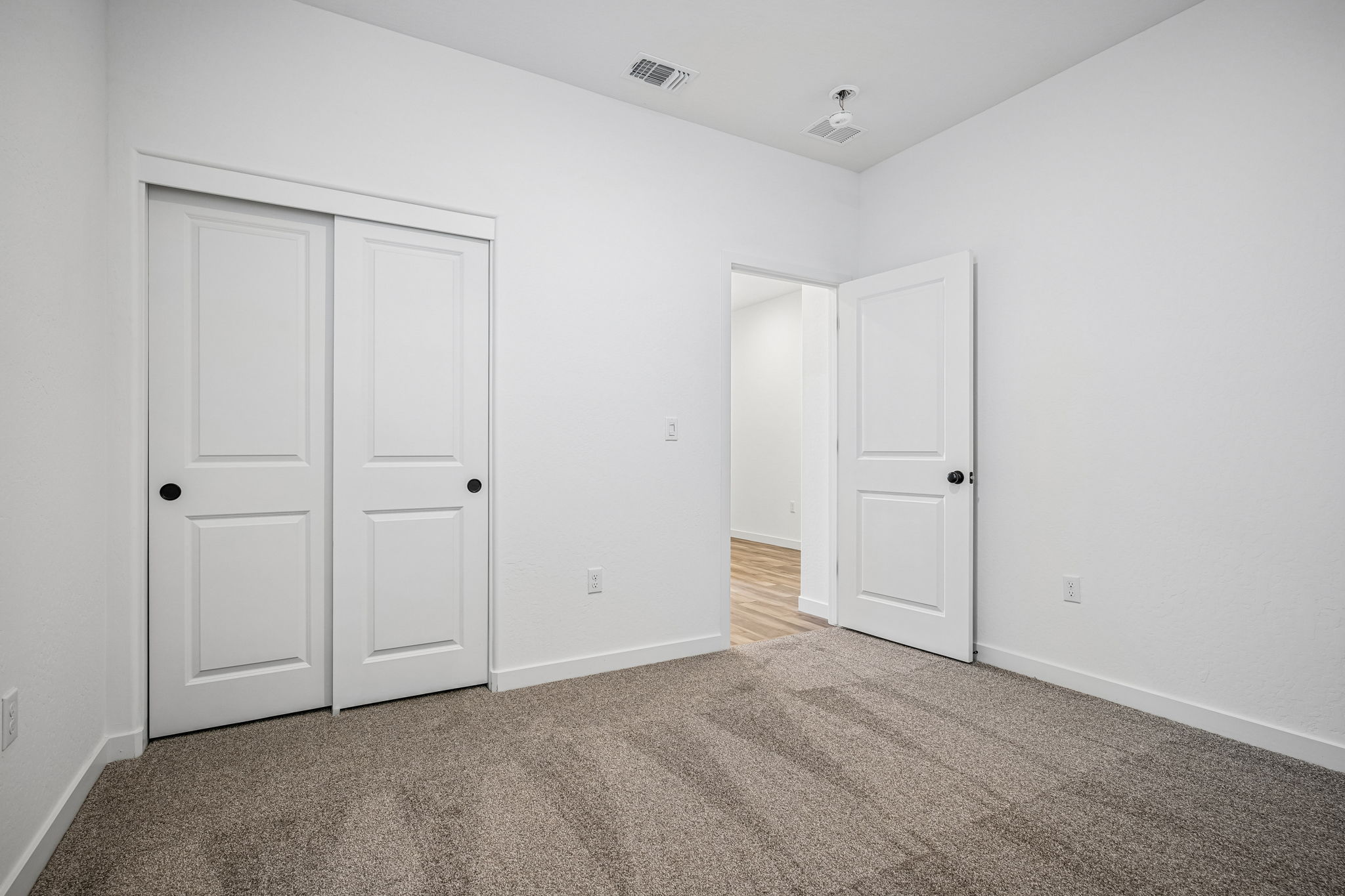 A room with white doors.