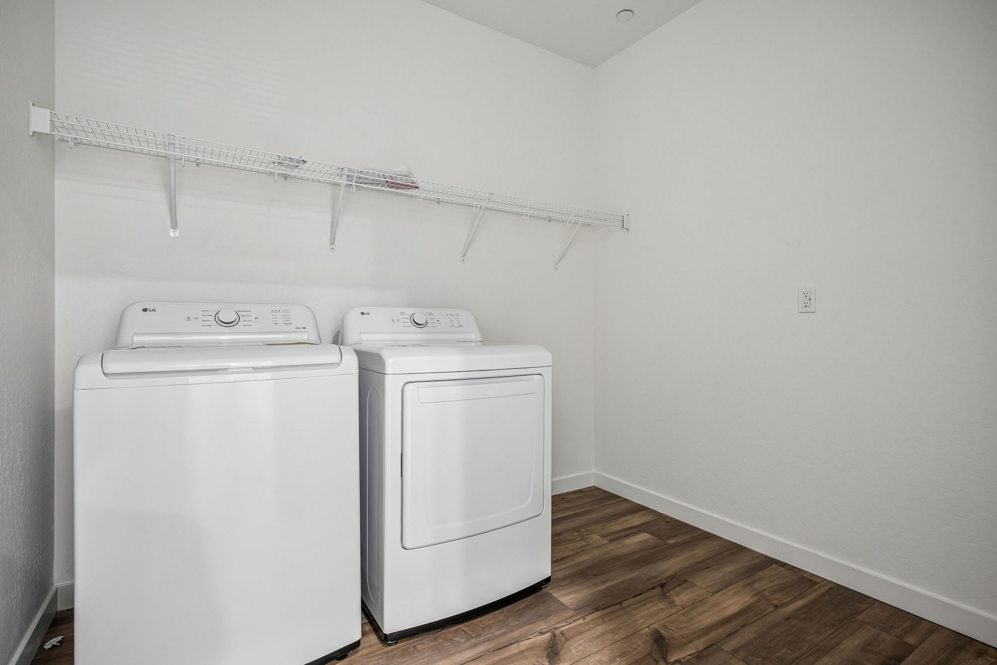 A white washer and dryer in a room.