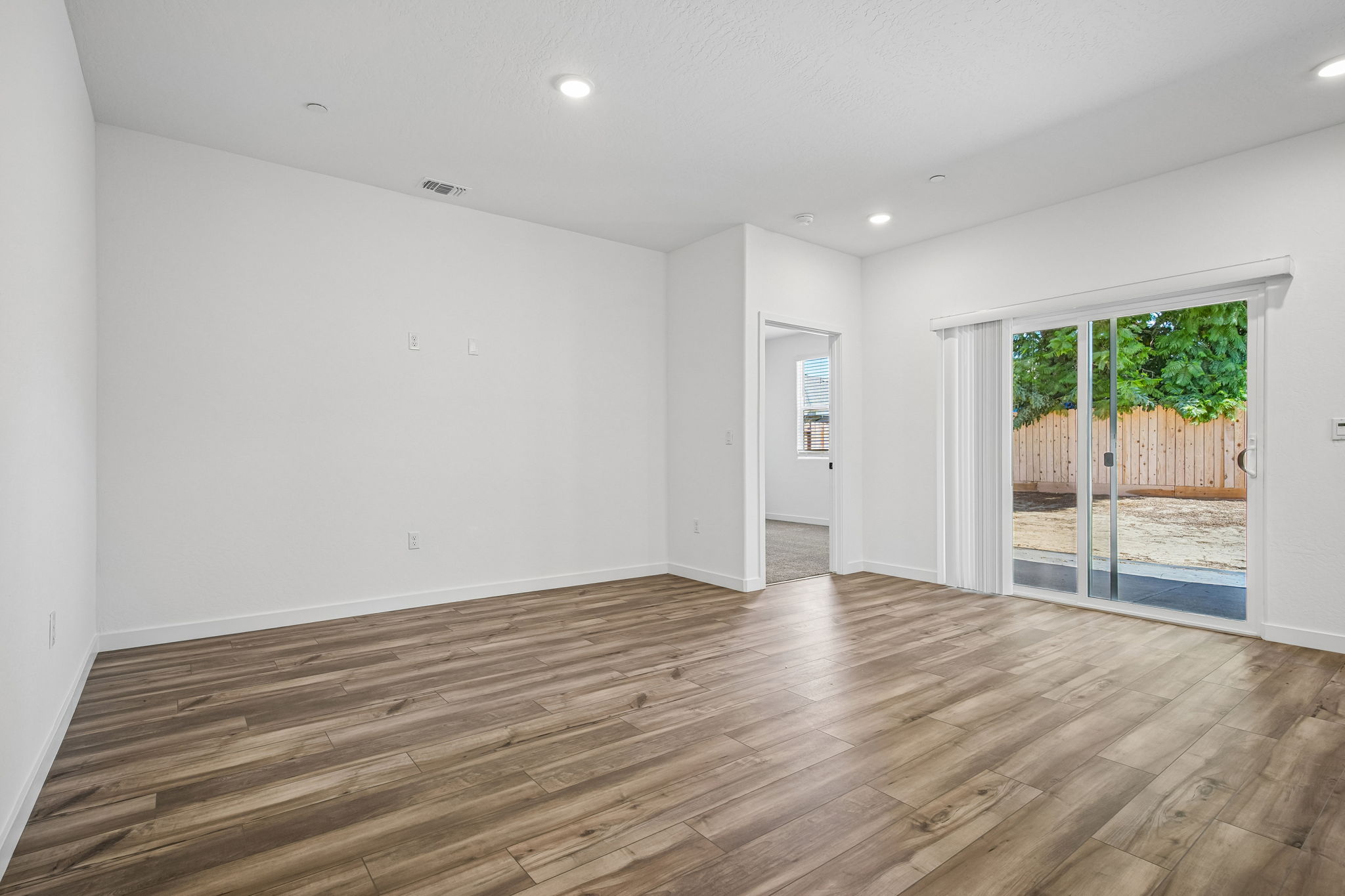 A room with a wood floor and a wood floor.